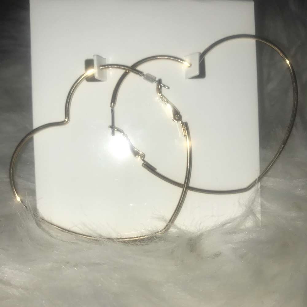 gold heart-shaped hoop earrings never worn